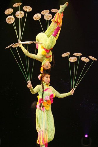 Chinese acrobats balancing on chairs